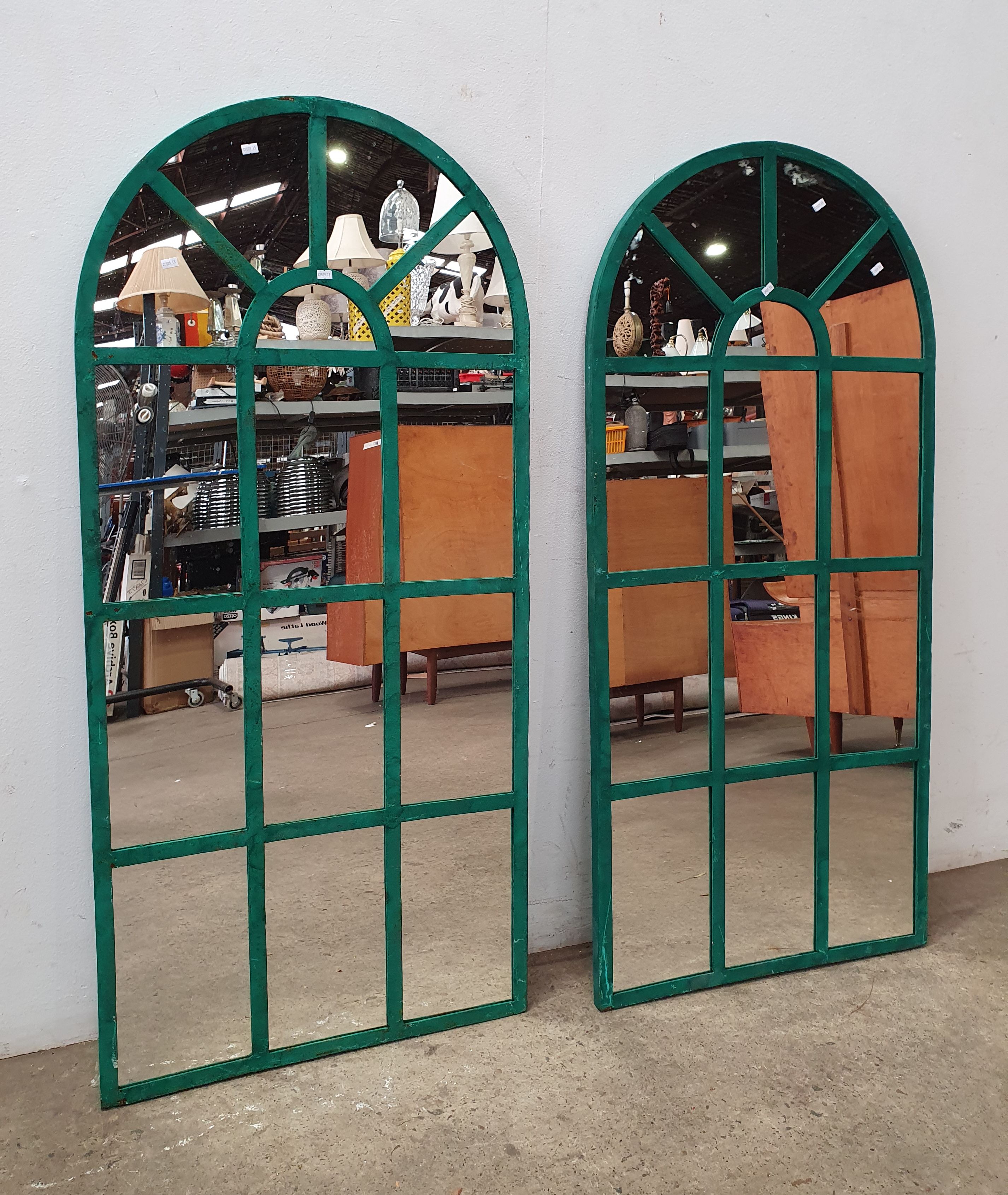 A Pair Of Iron Framed Arch Mirrors