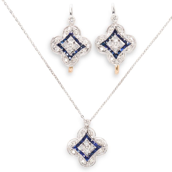 A sapphire and diamond earring and pendant necklace suite