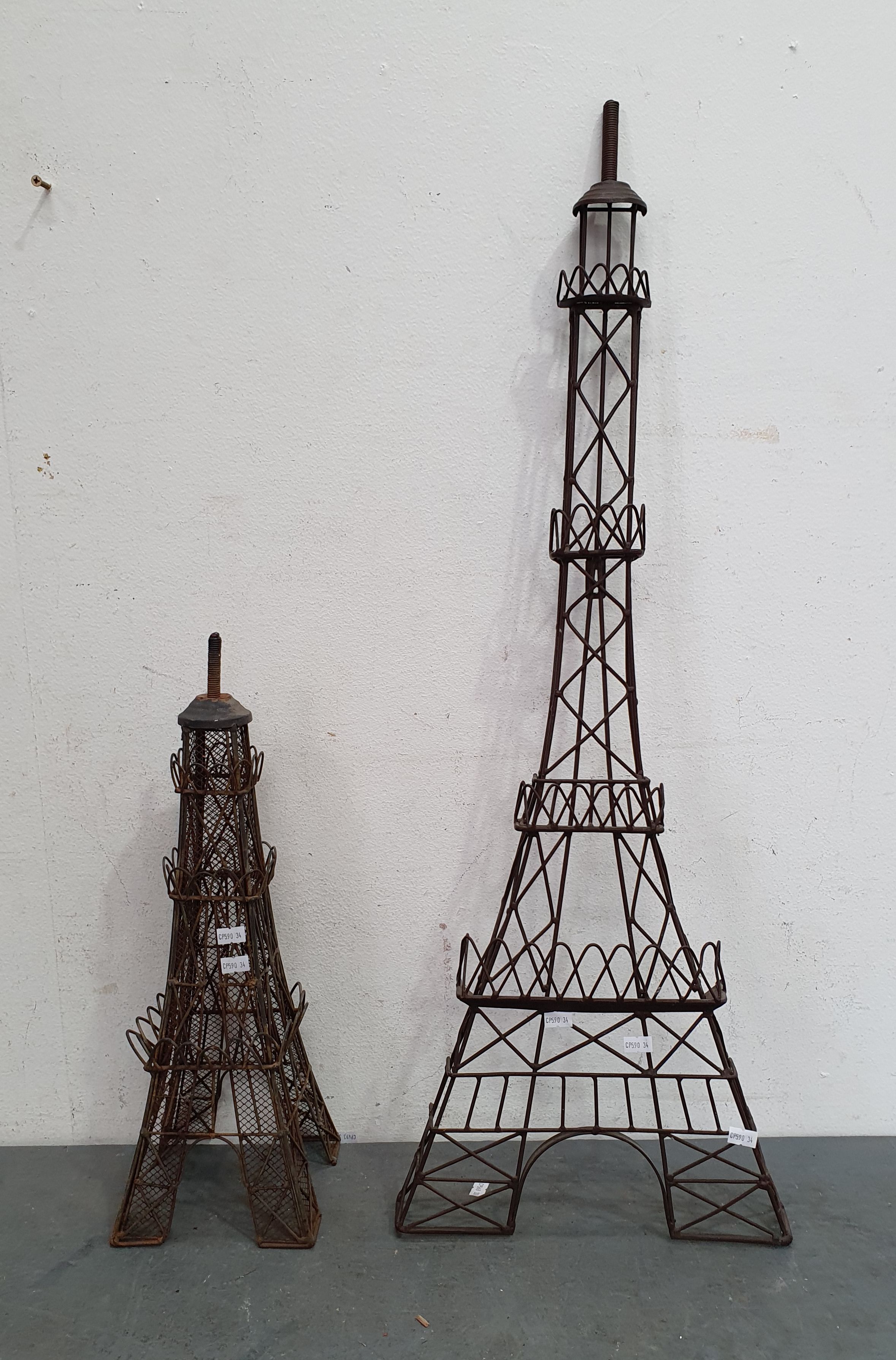 1254 · A PAIR OF EIFFEL TOWER STYLE GARDEN ORNAMENTS