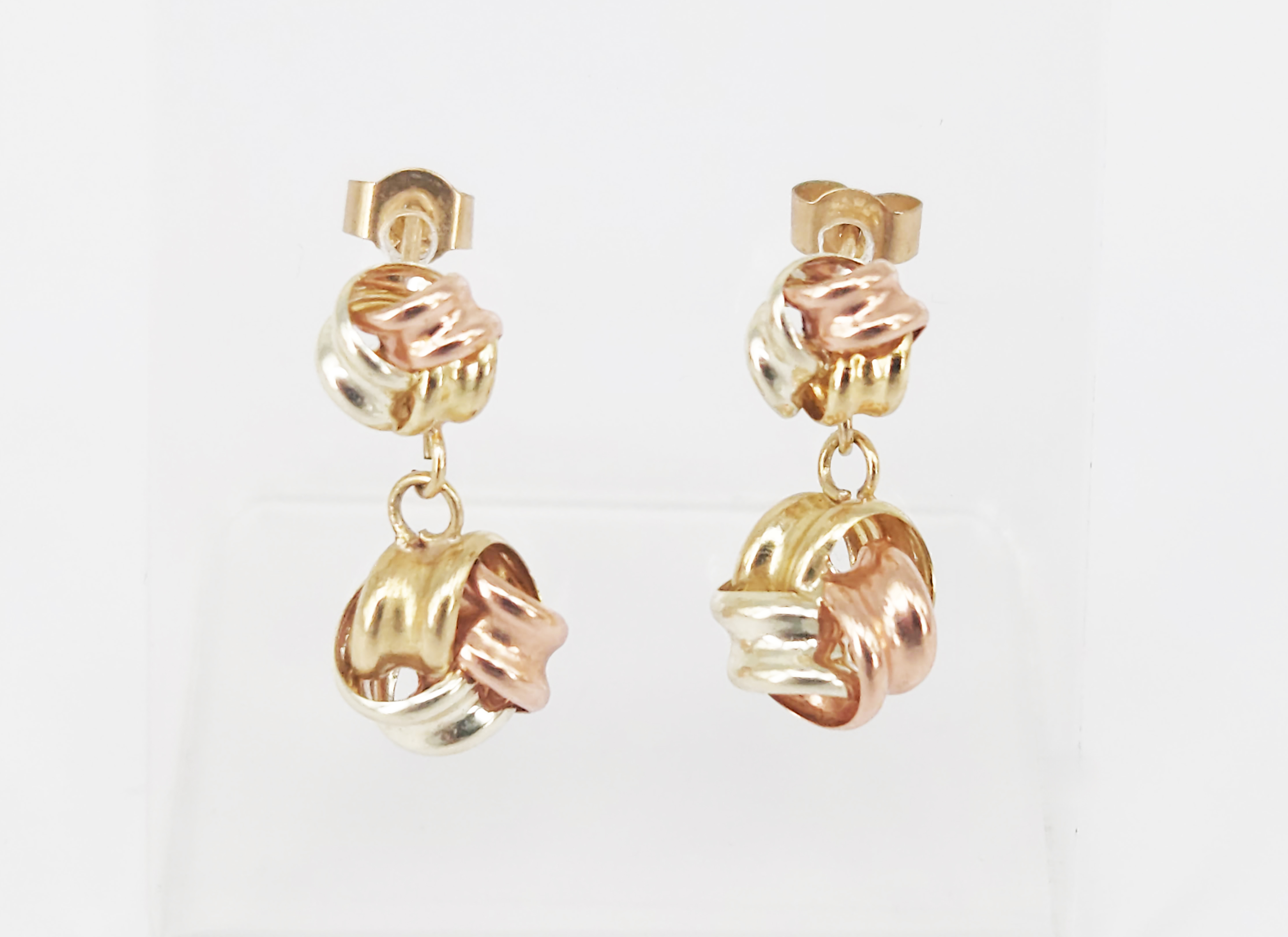 A Pair Of Tri-Tone 9ct Knot Earrings