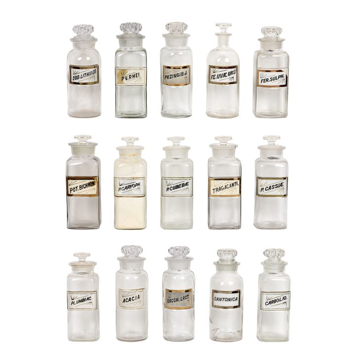 A collection of fifteen glass apothecary bottles