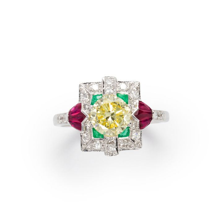 A Fancy Yellow diamond, gemstone and eighteen karat white gold ring