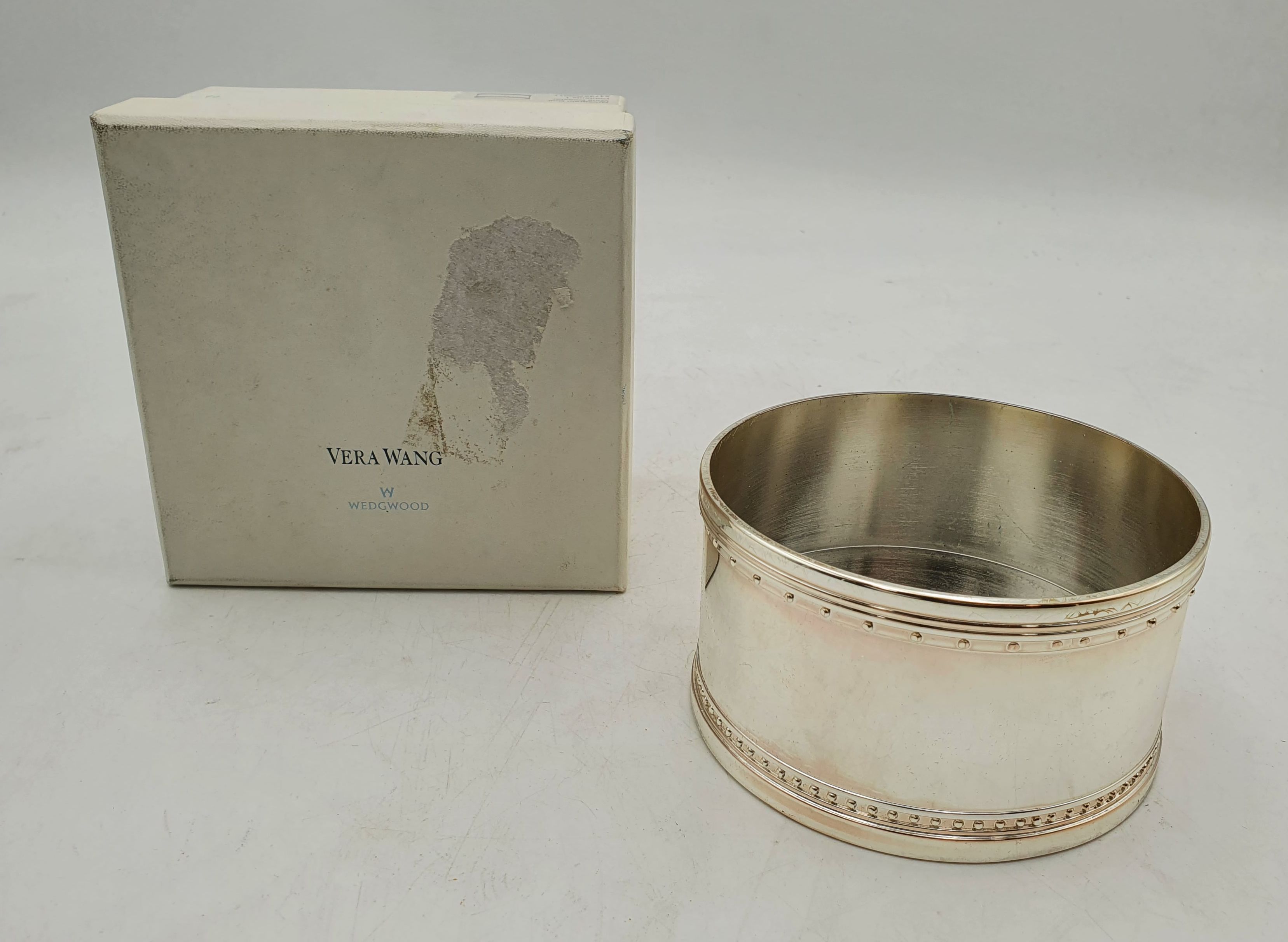 A VERA WANG FOR WEDGWOOD GROSGRAIN SILVER-PLATED BOTTLE COASTER