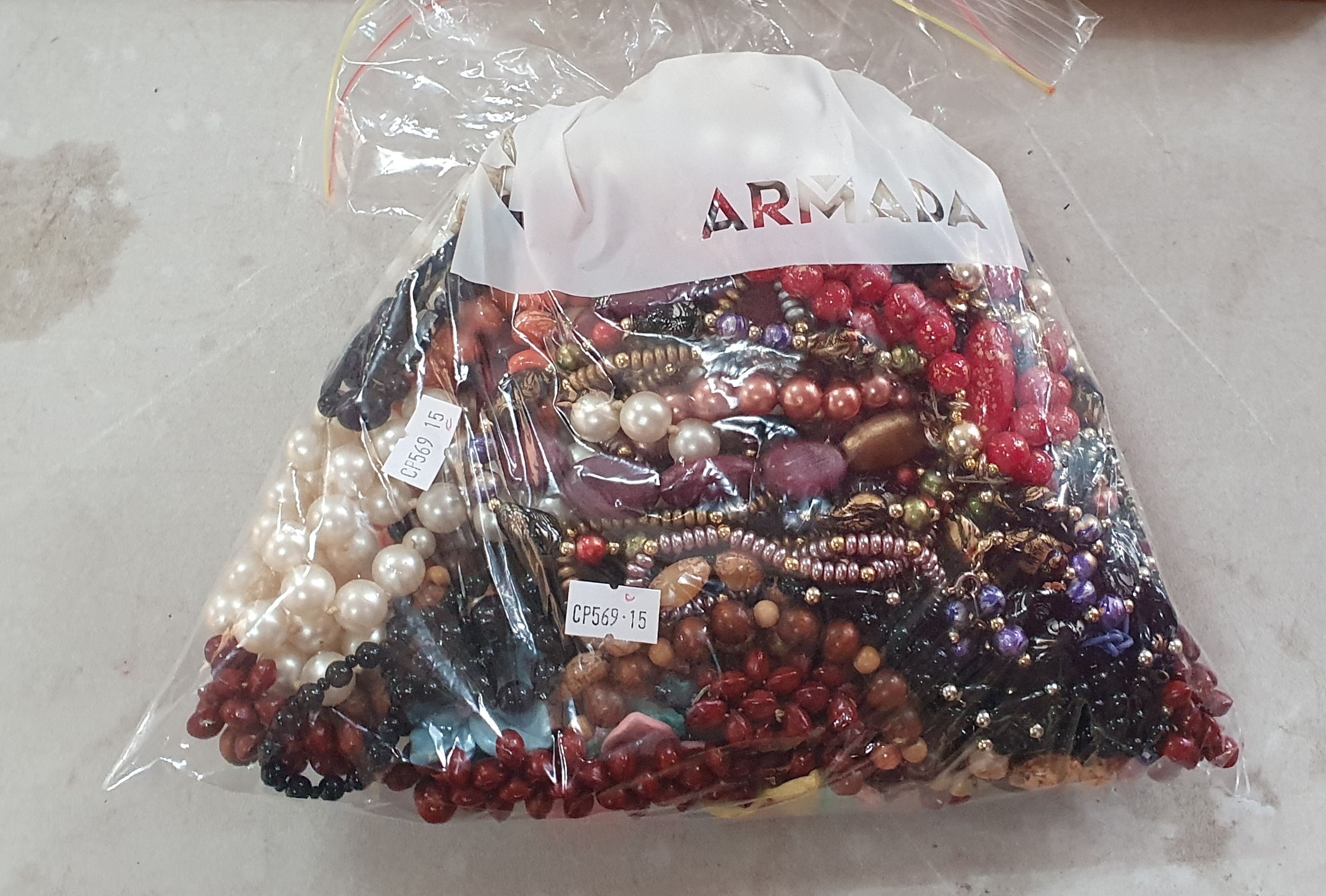 A Bag Of Costume Jewellery
