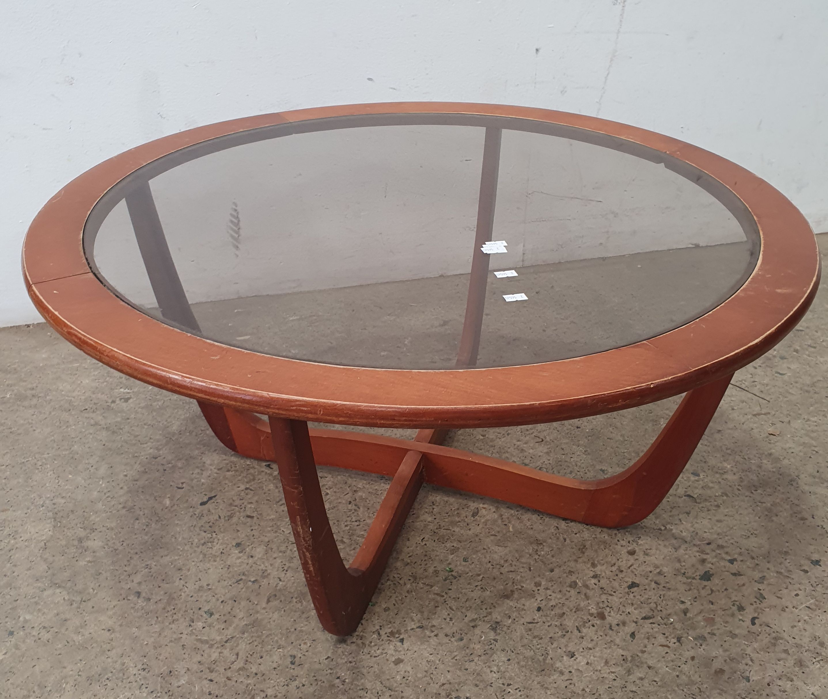 A MID CENTURY CIRCULAR COFFEE TABLE
