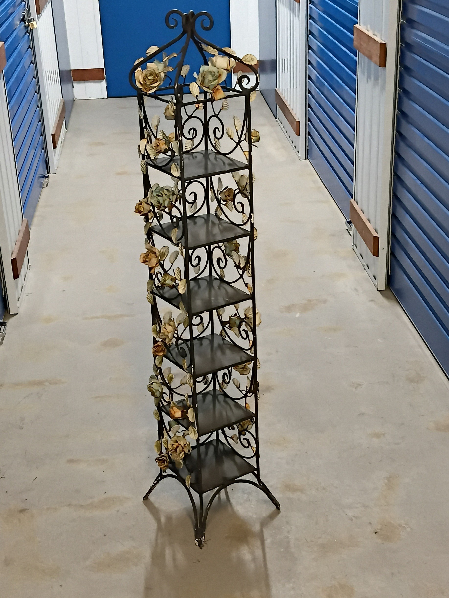 1034 · A METAL SIX TIER STORAGE SHELF