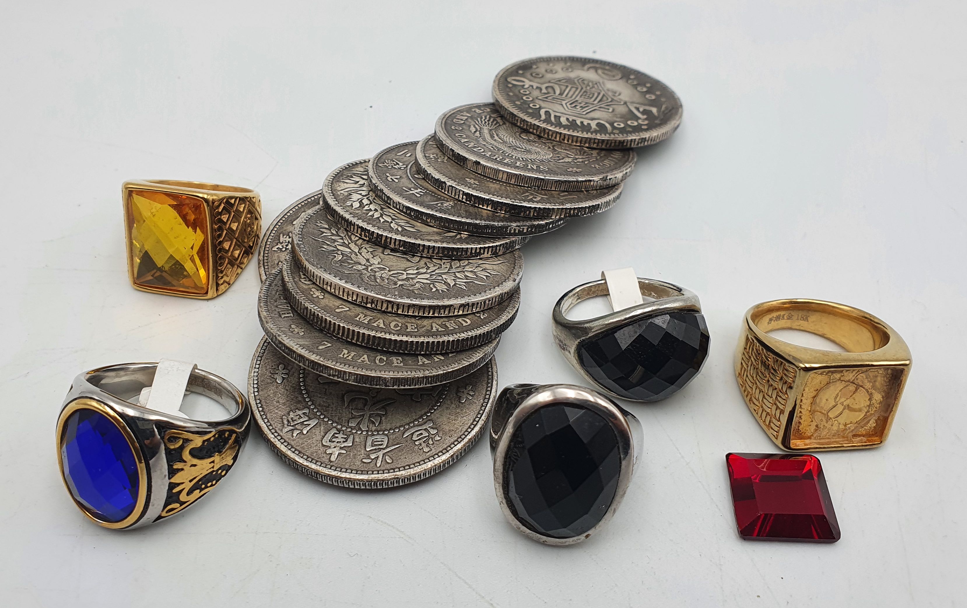 280 · A BAG OF TEN CHINESE WHITE METAL MEDALLIONS AND FIVE RINGS