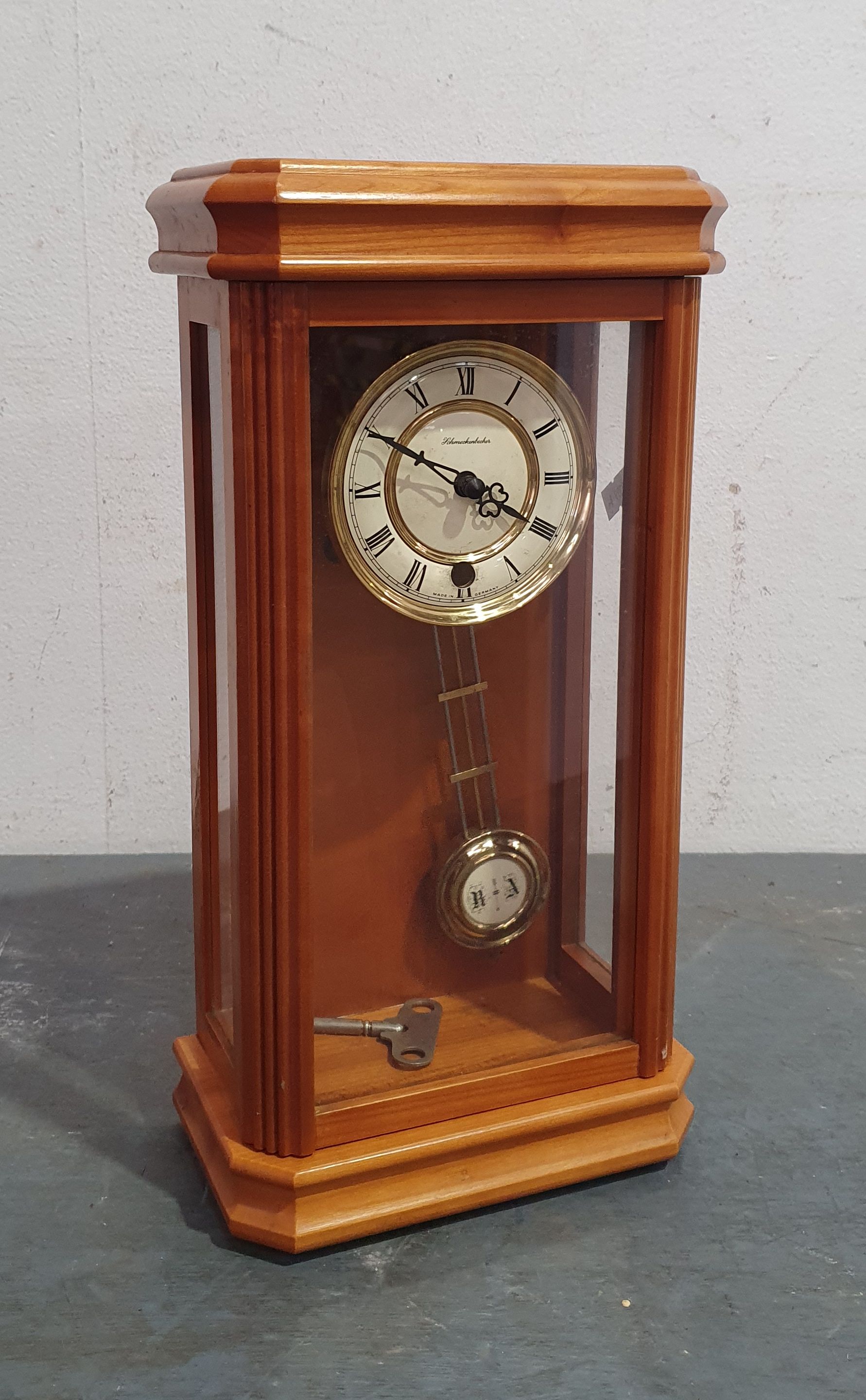 A GERMAN PENDULUM CLOCK