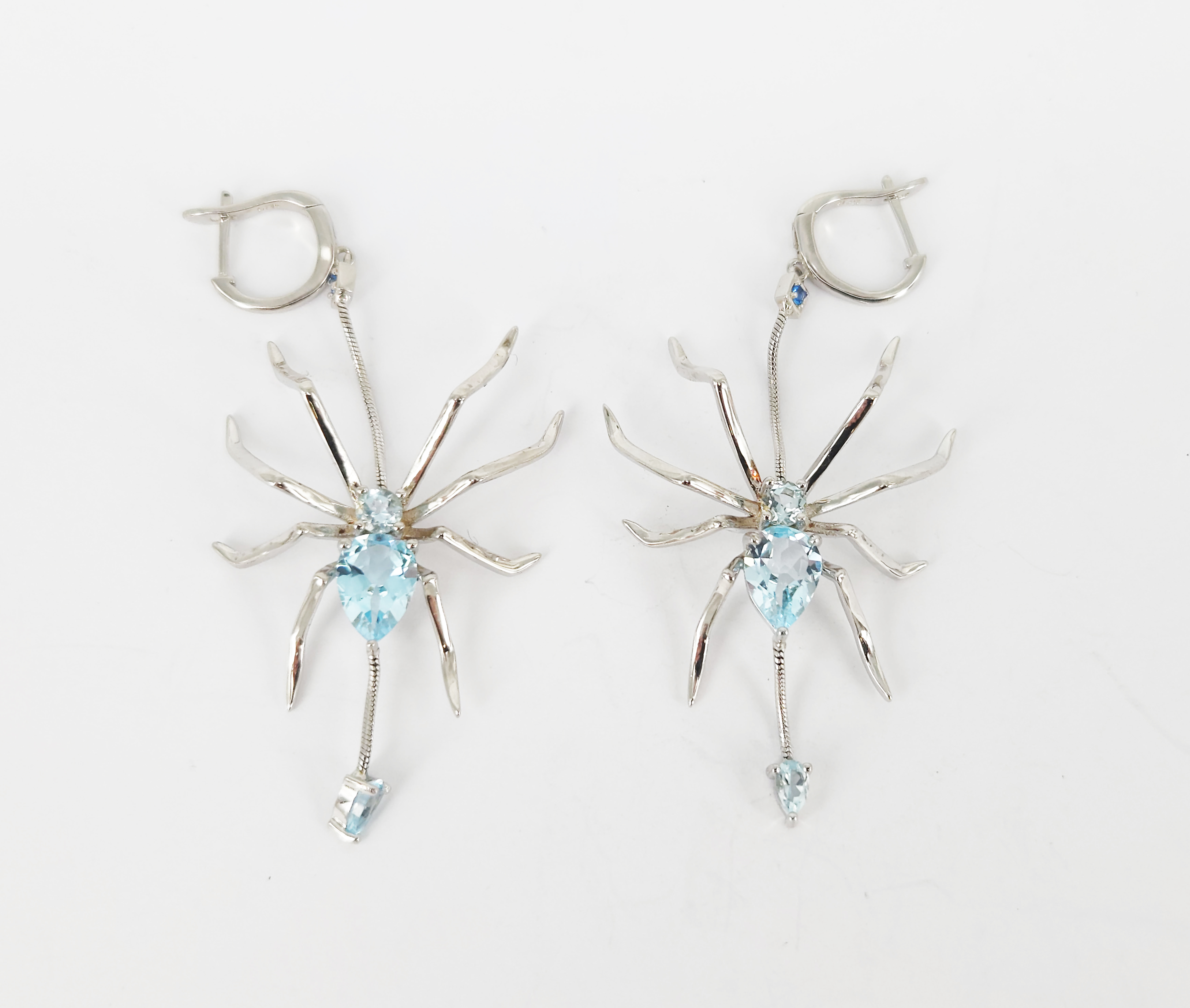 327 · A PAIR OF SILVER AND TOPAZ 'SPIDER' DROP EARRINGS