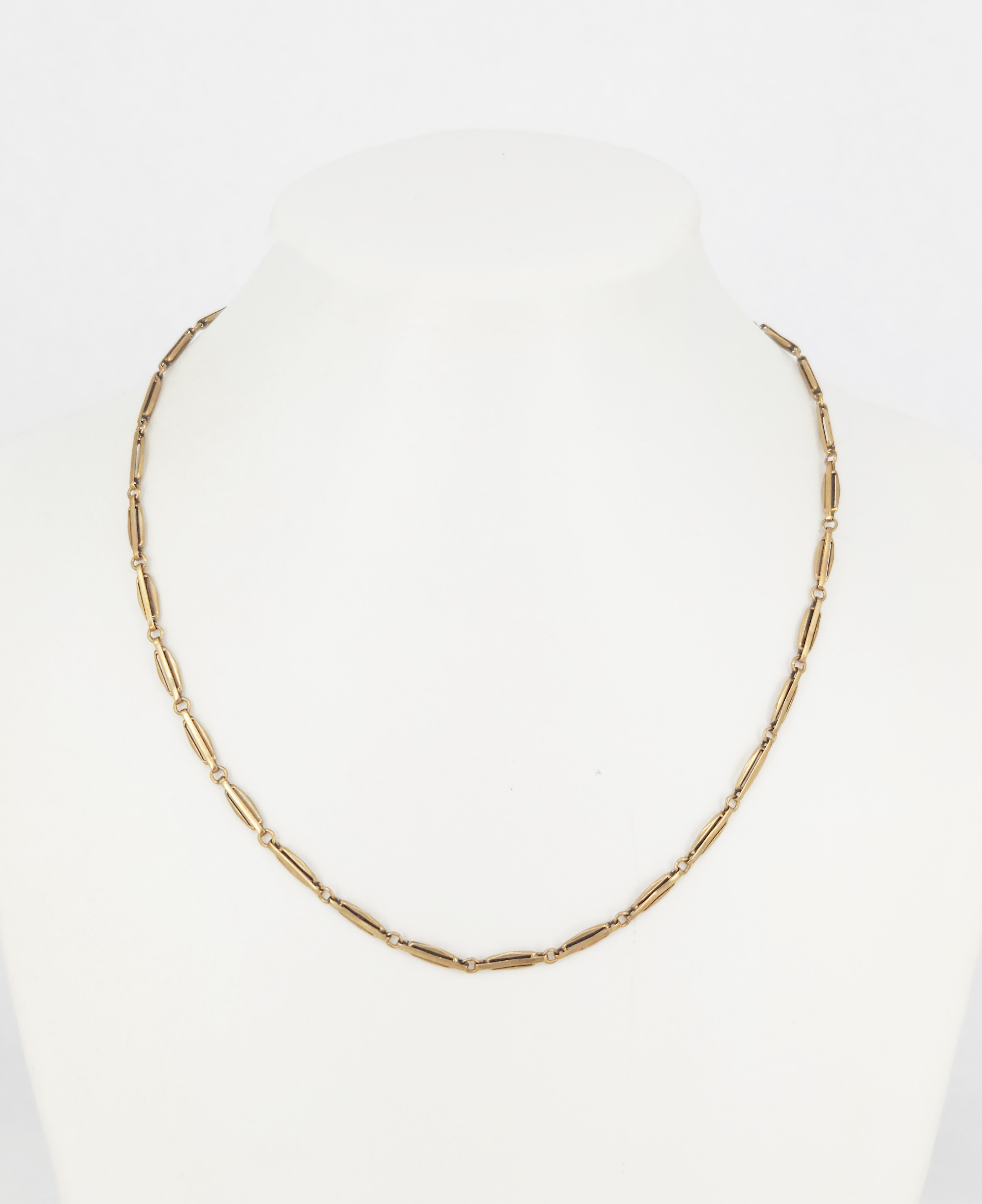 AN ART DECO YELLOW GOLD-FILLED WATCH CHAIN