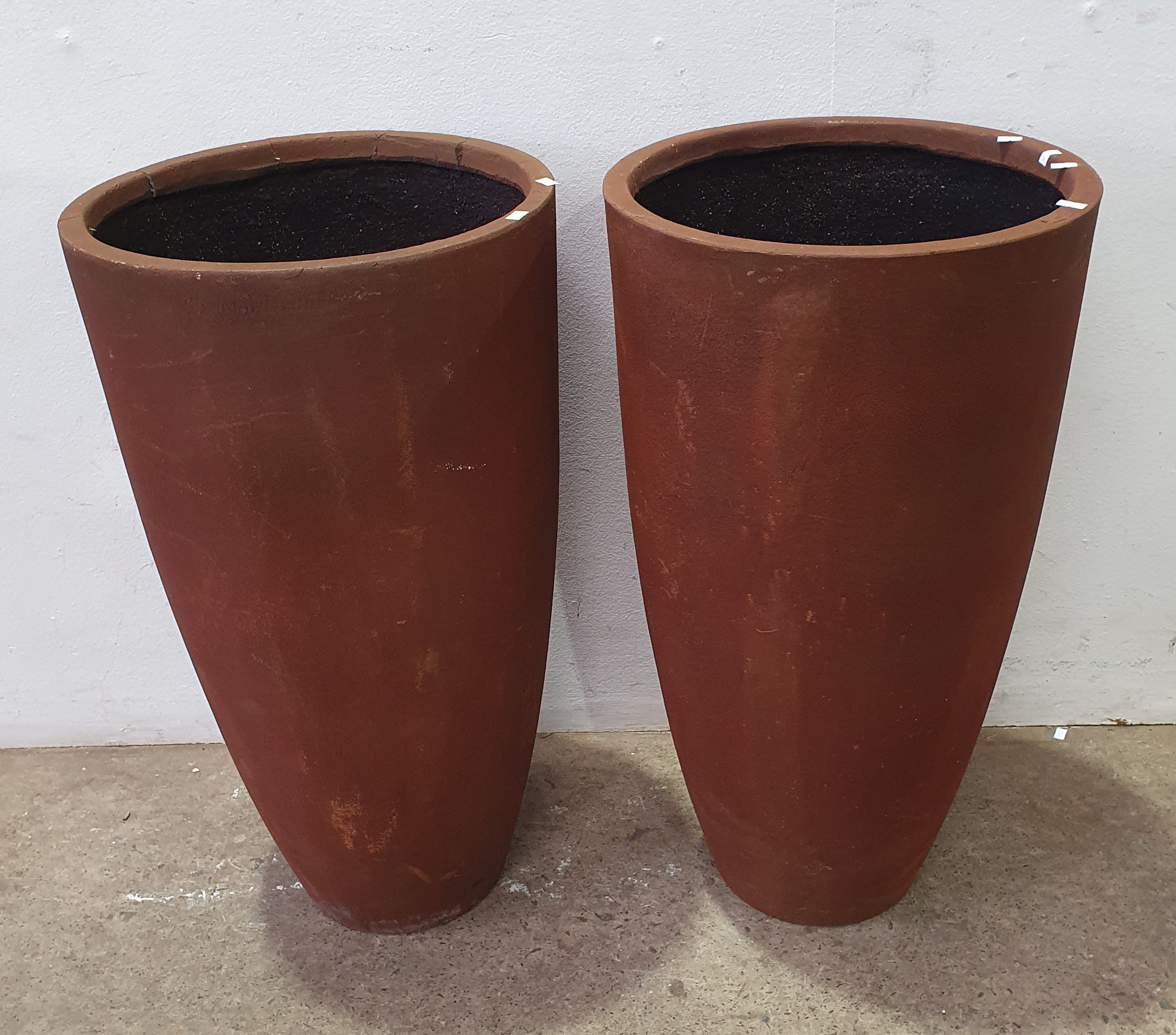 A Pair Of Tall Fibreglass Pots