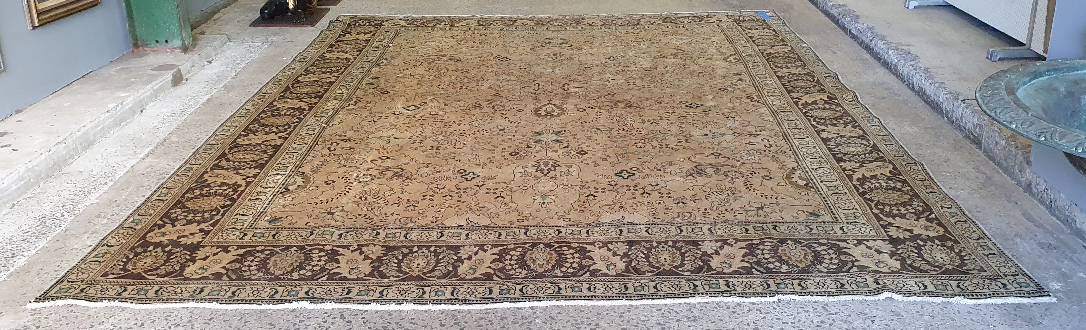 A ROOM SIZE OUSHAK STYLE WOOLLEN CARPET