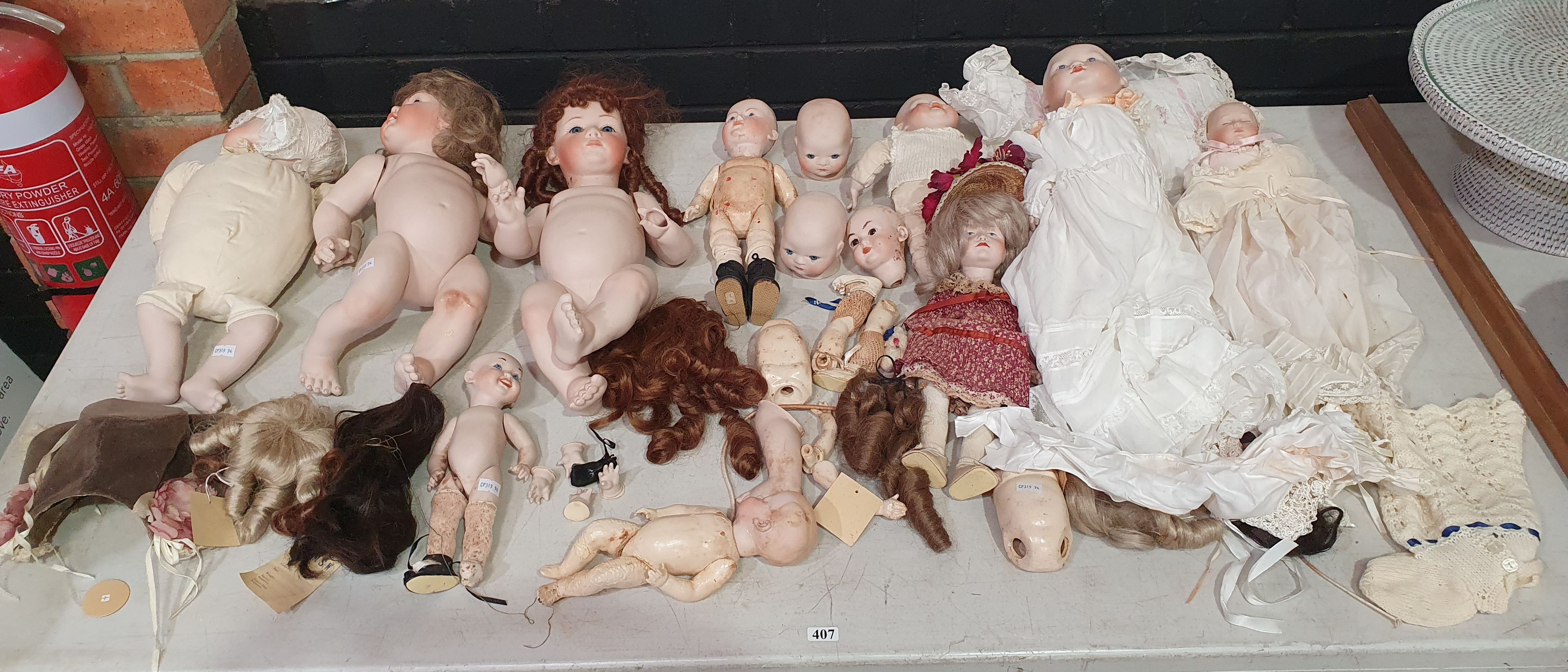 407 · A GROUP OF MAINLY GERMAN DOLLS AND DOLL PARTS