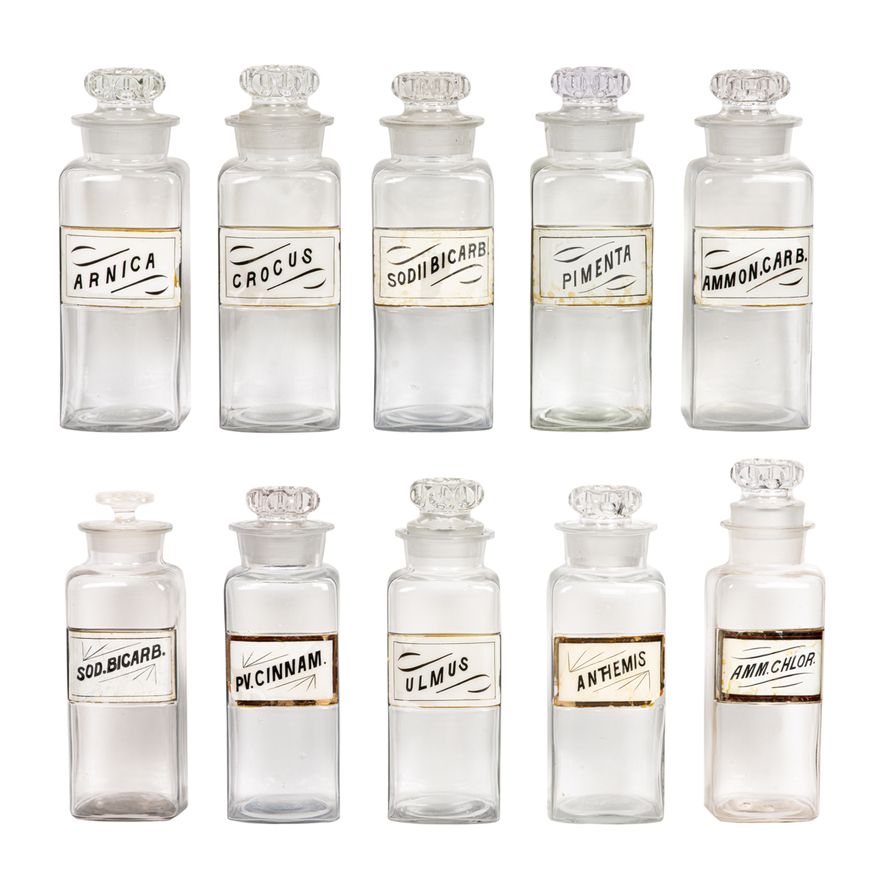 A group of ten glass apothecary bottles