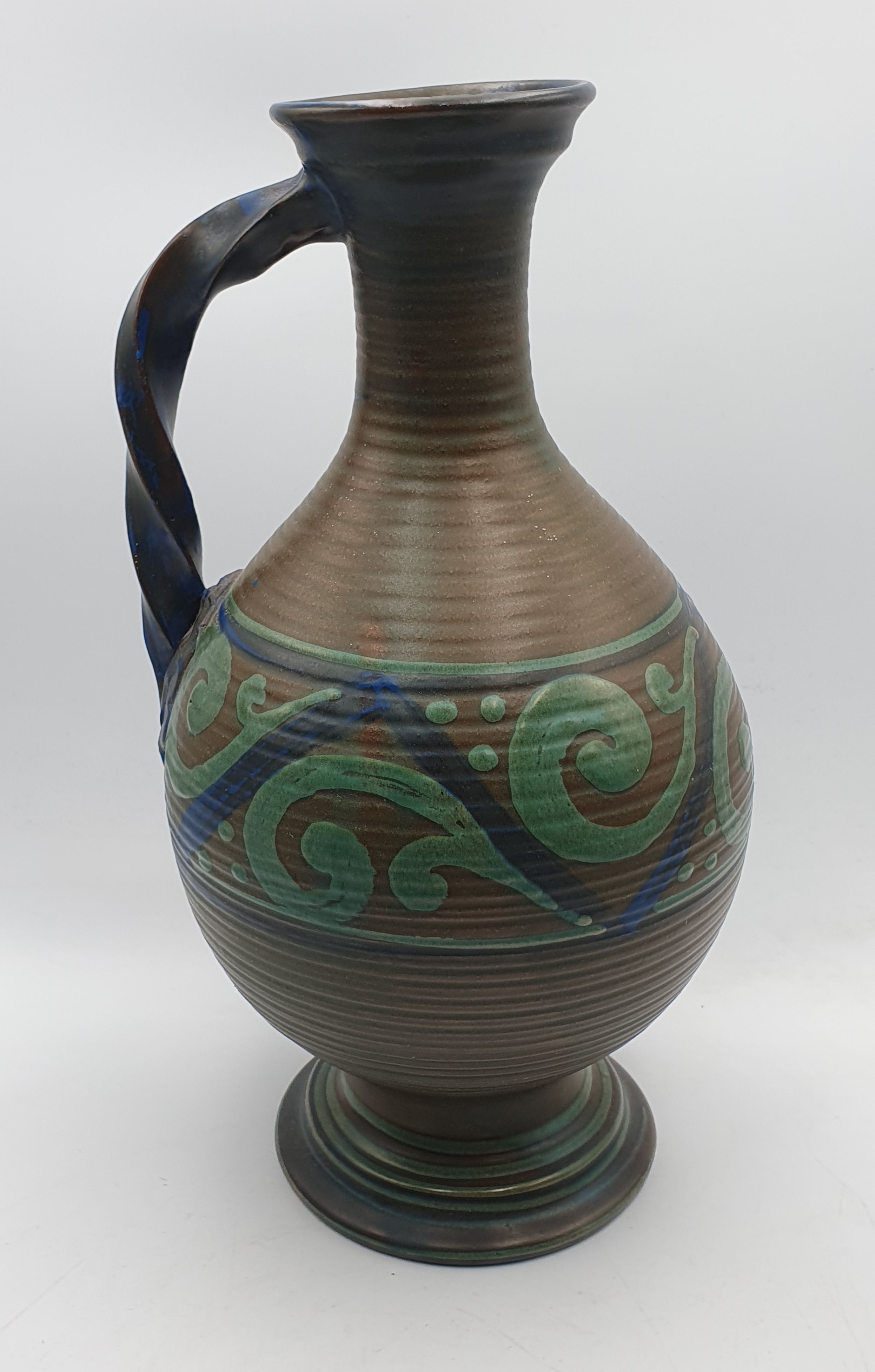 212 · AN EARLY 20th CENTURY EUROPEAN POTTERY JUG